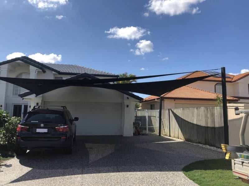 Large Shade Sails insalled in front of the garage area of a modern residential home in Brisbane